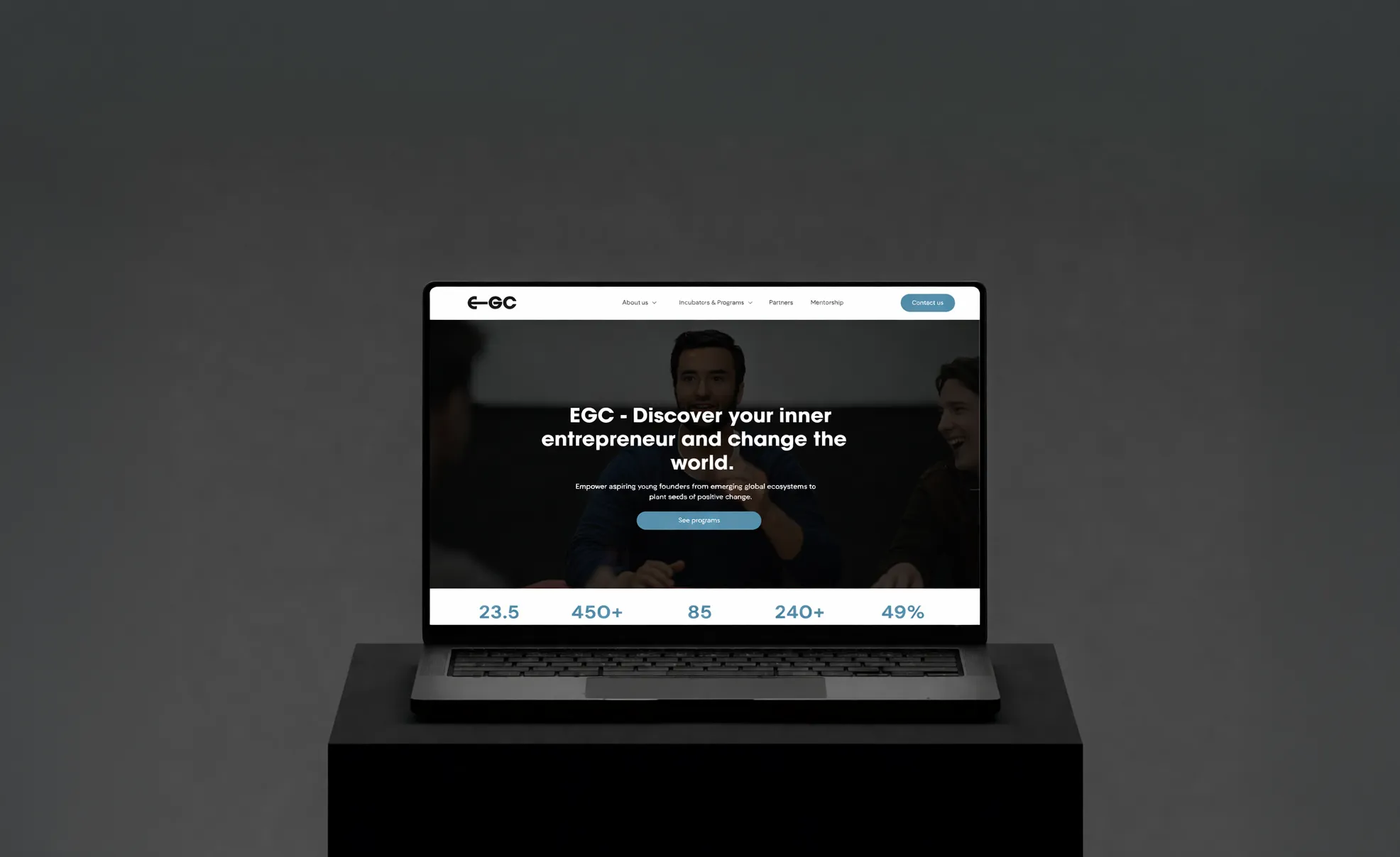 Laptop displaying EGC website homepage with the text Discover your inner entrepreneur and change the world.